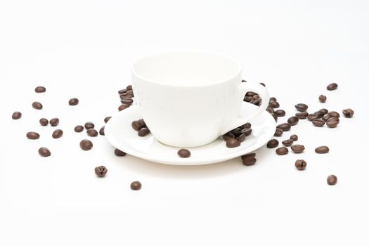 Coffee beans and white coffee cup isolated on white background.