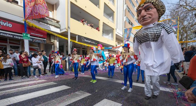 Loule, Portugal - February 25, 2020: dancers parading in the street in front of the public in the parade of the traditional carnival of Loule city on a February day