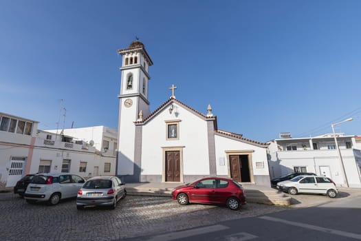 Quarteira, Portugal - February 27, 2020: Architecture detail of the Church of Our Lady of Conception (Nossa Senhora da Conceicao) on a winter day