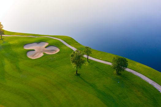 Aerial view of golf field landscape with sunrise view in the morning shot. Bangkok Thailand