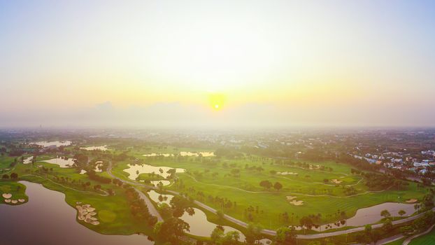 Aerial view of golf field landscape with sunrise view in the morning shot. Bangkok Thailand