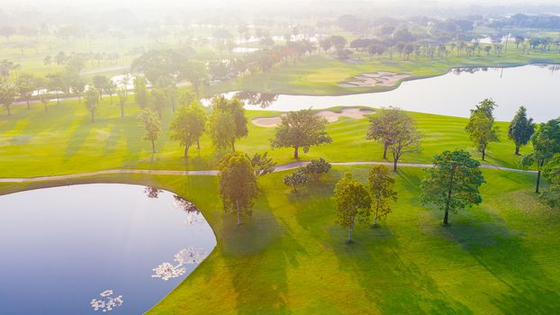 Aerial view of golf field landscape with sunrise view in the morning shot. Bangkok Thailand