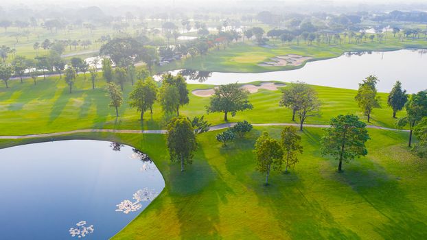 Aerial view of golf field landscape with sunrise view in the morning shot. Bangkok Thailand