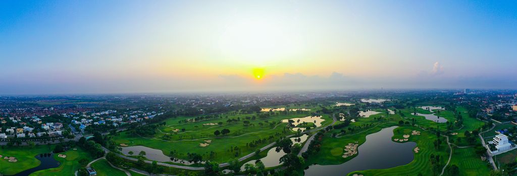 Aerial view of golf field landscape with sunrise view in the morning shot. Bangkok Thailand