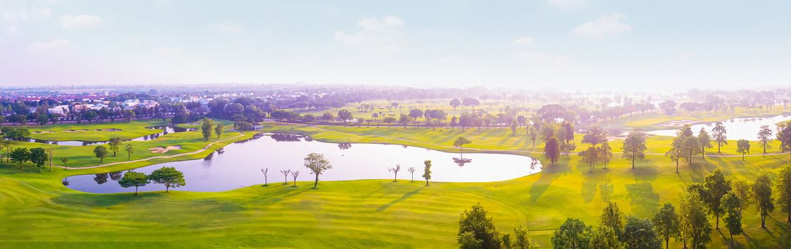 Aerial view of golf field landscape with sunrise view in the morning shot. Bangkok Thailand