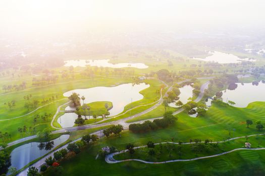 Aerial view of golf field landscape with sunrise view in the morning shot. Bangkok Thailand