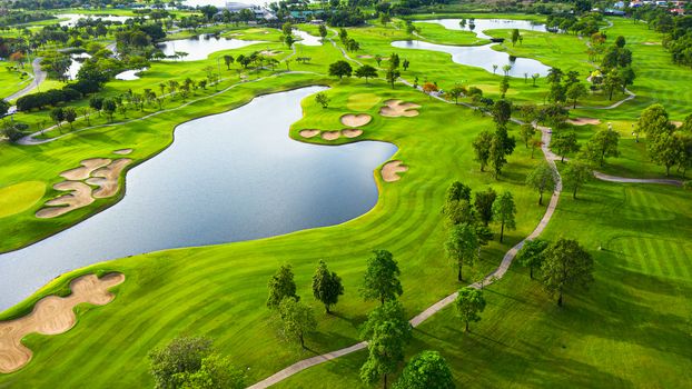 Aerial view of golf field landscape with sunrise view in the morning shot. Bangkok Thailand