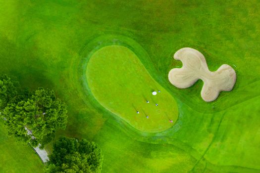 Aerial view of golf field landscape with sunrise view in the morning shot. Bangkok Thailand