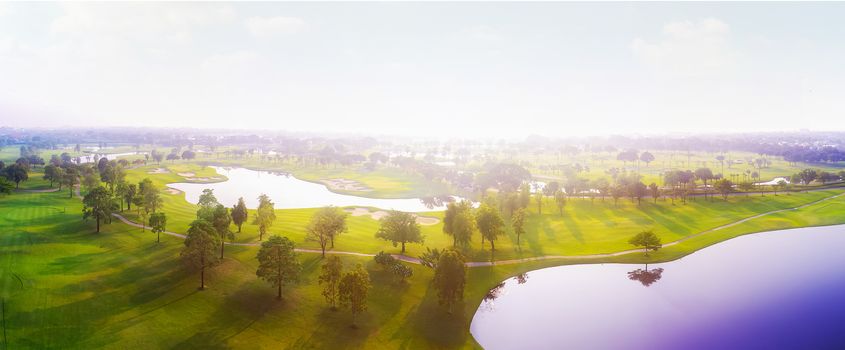 Aerial view of golf field landscape with sunrise view in the morning shot. Bangkok Thailand