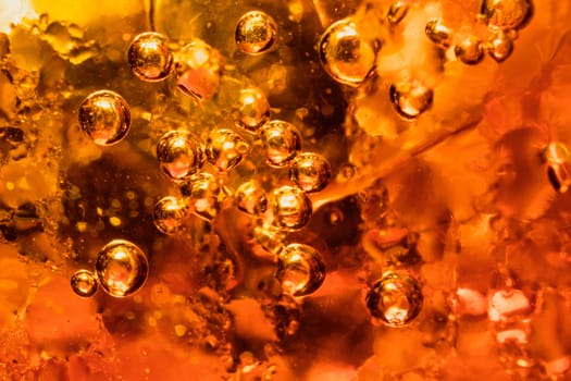 abstract water with  bubbles soars over a golden background