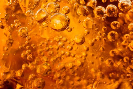 abstract water with  bubbles soars over a golden background