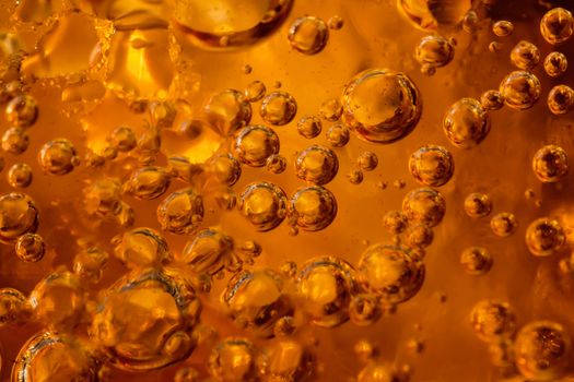 abstract water with  bubbles soars over a golden background