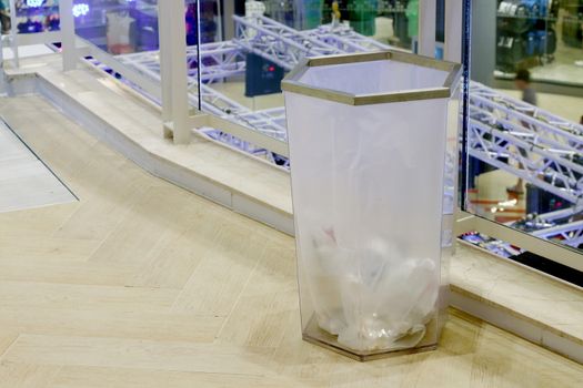 bin clear plastic trash in the mall, waste plastic bin on floor shopping mall inside