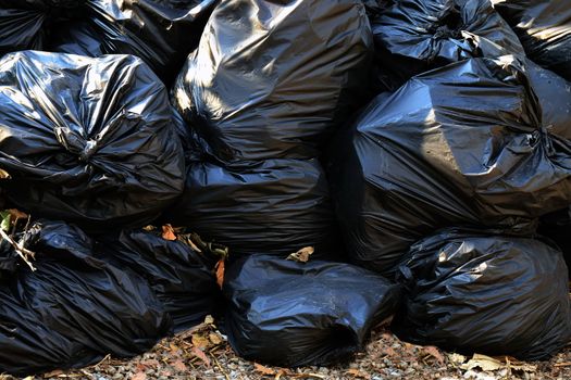 pile waste plastic bags many garbage trash closeup for background, pile of garbage plastic black, pollution trash plastic waste and bag background