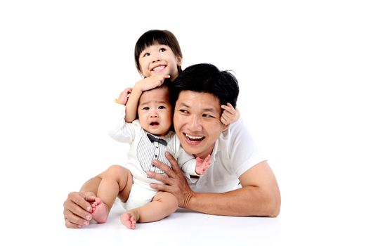 Portrait of a happy asian family in the studio