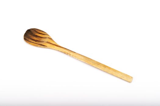 wooden kitchen spoon on white background in studio