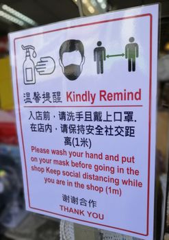Notice of social distancing measures seen from the outside of a shop in chinese and english language..Vector illustration of small business owner. Please wash hand and wear a face mask and keep your distance 1 meter to protect from Covid-19, Coronavirus pandemic.