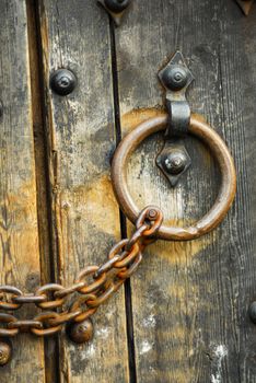 Heavy wooden doors with chains and padlocks are all about security