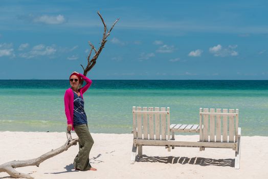 Young woman at beautiful tropical beach with white sand. Bai Sao, Phu Quoc, Vietnam