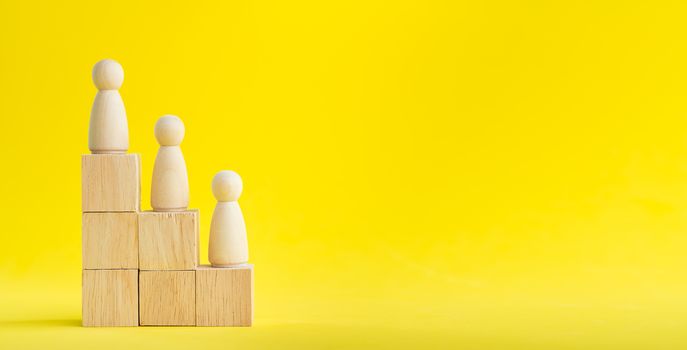 Banner Group of wood figure Standing in the hierarchy on wood stack in human resource management concepts Teamwork Success Leadership Business Progress, Competition on yellow backgrond and copy space