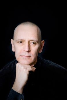 Portrait of a caucasian man on black background