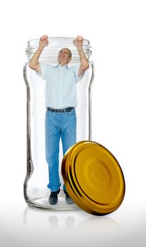 Man escaping from a  glass jar with the open gold color lid