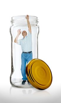 Man escaping from a  glass jar with the open gold color lid