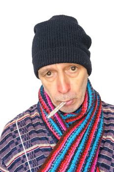 Sick man with the flu and temperature, wearing a cap and a woolen scarf, on white background