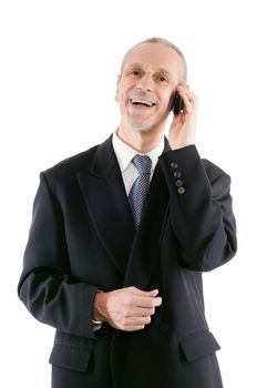 A friendly businessman smiling on mobile phone