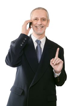 An handsome businessman smiling on mobile phone and showing the forefinger