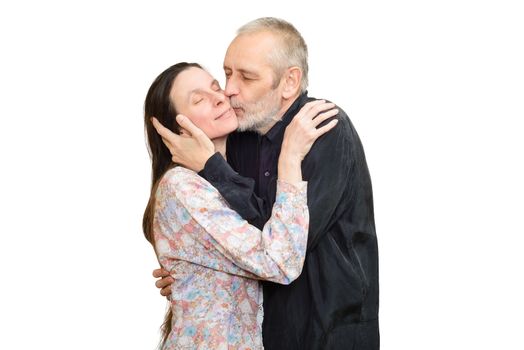 Adult man kissing his  wife with love for S. Valentine's day or anniversary. Isolated on white background.