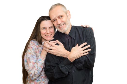 Happy mature man and woman with long hair smiling for S. Valentine's day or anniversary and embracing each other. Isolated on white background.