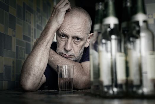 A desperate man falls into depression and becomes alcoholic and miserable. His addiction leads him to a state of loneliness and poverty. He has no hope and could be suicidal.