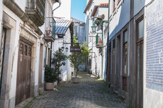 Viana Do Castelo, Portugal, Portugal - May 10, 2018: Architecture detail of typical houses and shops in the streets of the historic city center that tourists visit on a spring day