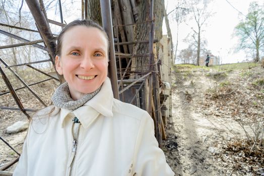 Smiling, sweet and cheerful adult woman outdoor during a nice spring day