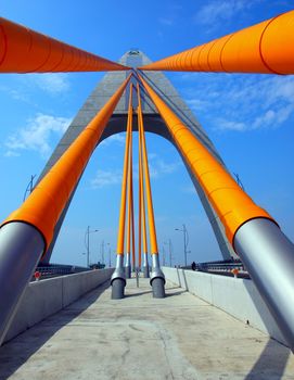 A modern single tower cable stayed bridge with massive steel cables

