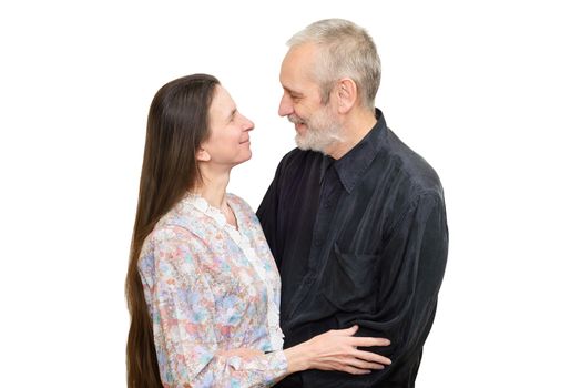 Mature man and woman with long hair looking at each other with love, eyes in eyes, for S. Valentine's day or anniversary. Isolated on white background.