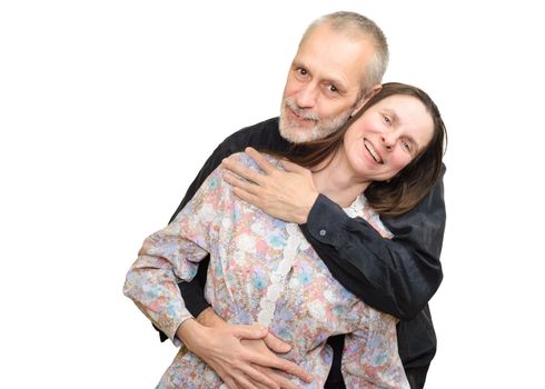 Happy adult man and woman smiling for S. Valentine's day or anniversary and embracing each other. Isolated on white background.