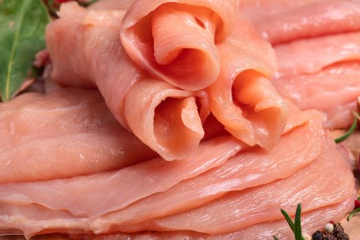 Raw sliced chicken meat close-up. Sotilissimo. Delicious dietary meat. Cooking,food of meat and fillets.
