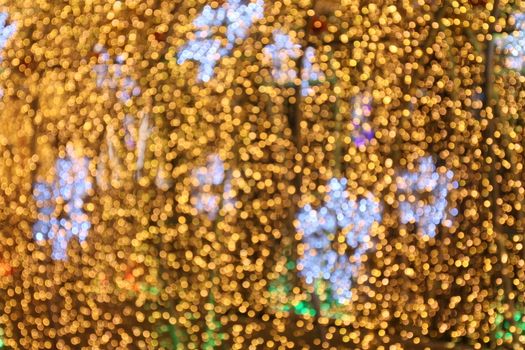 Bokeh background and snow shape gold yellow colorful merry christmas, Happy new year bokeh lighting shine on night background, Bokeh glitter light, Gold Luxury backdrop texture, Glittering wallpaper