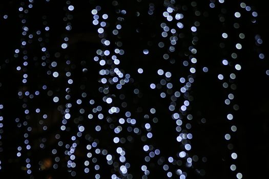 Lighting magic background blurred bokeh cycle light night, merry Christmas and happy New Years bokeh light picture, blur light for decoration Restaurant wall Night