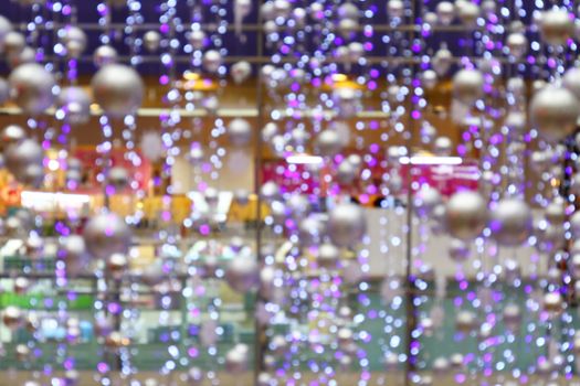 blurred background bokeh light abstract of Interior lighting department store, lighting decoration in shopping mall