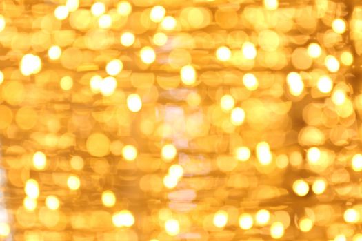 Bokeh background gold yellow colorful of merry christmas, Happy new year bokeh lighting shine on night background, Bokeh glitter light, Gold Luxury backdrop texture, Glittering wallpaper