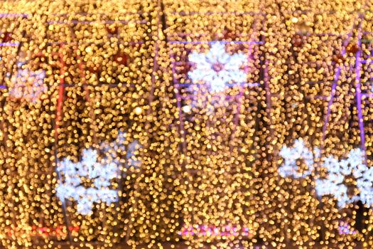 Bokeh background and snow shape gold yellow colorful merry christmas, Happy new year bokeh lighting shine on night background, Bokeh glitter light, Gold Luxury backdrop texture, Glittering wallpaper