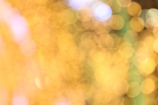 Bokeh background gold yellow colorful of merry christmas, Happy new year bokeh lighting shine on night background, Bokeh glitter light, Gold Luxury backdrop texture, Glittering wallpaper