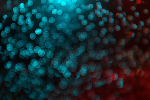 Abstract blurred Bokeh light blue and red glittering for night background
