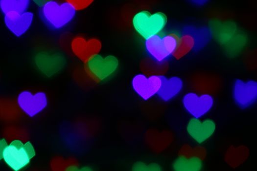 Valentines Colorful heart-shaped bokeh on black background lighting bokeh for decoration at night backdrop wallpaper blur valentine, Love Pictures background, Lighting heart shaped soft night abstract