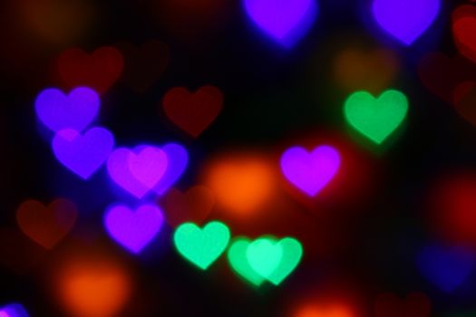 Valentines Colorful heart-shaped bokeh on black background lighting bokeh for decoration at night backdrop wallpaper blur valentine, Love Pictures background, Lighting heart shaped soft night abstract