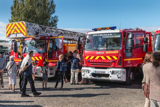 Saint Gilles Croix de Vie, France - July 13, 2016: presentation of fire engines to the public in the city fire station on the eve of the national holiday on a summer day