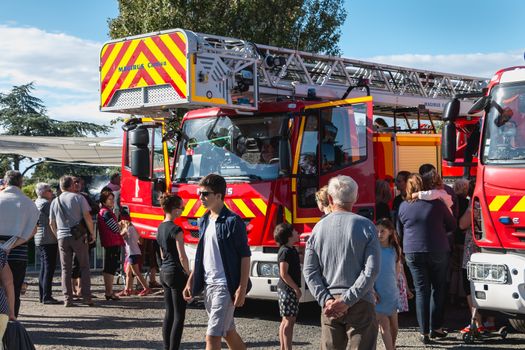 Saint Gilles Croix de Vie, France - July 13, 2016: presentation of fire engines to the public in the city fire station on the eve of the national holiday on a summer day